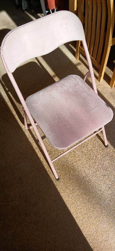 Padded pink folding chair