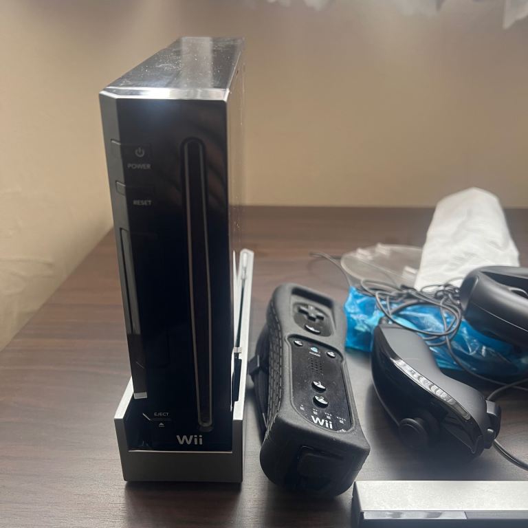Nintendo Wii Console with Controllers and Steering Wheel