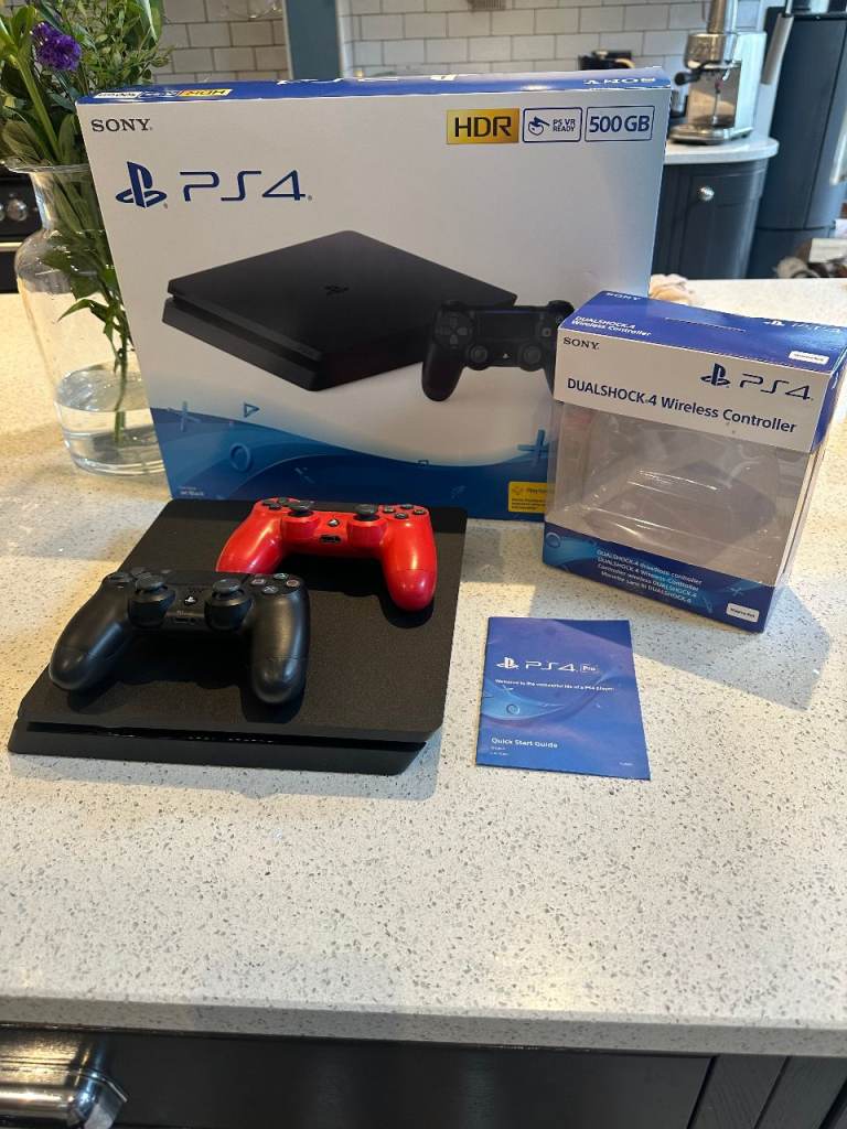 PS4 console and 2 X controllers boxed