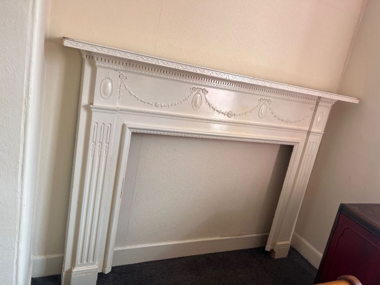 FREE: Cream Wooden Fireplace Surround with Carved Details
