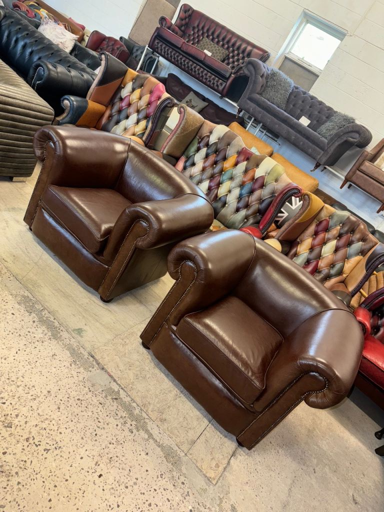 Pair of chesterfield style brown real leather club chairs