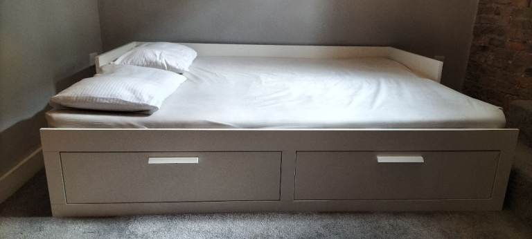 A sofa by day and a bed (for one or two) by night - to be collected. 