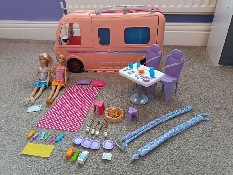 Barbie Campervan with accessories, instructions and two barbies.