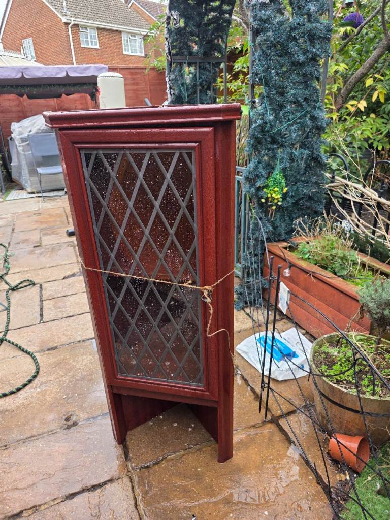 Top half of corner unit with glass door