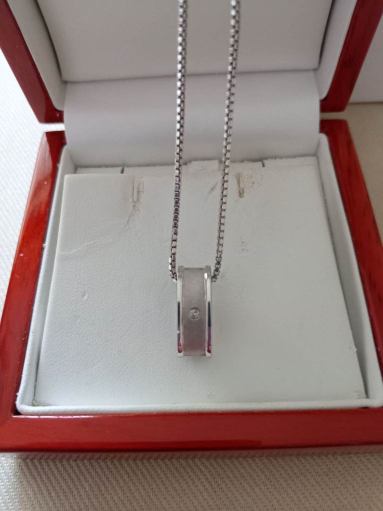 Sterling silver necklace with diamond set pendant 