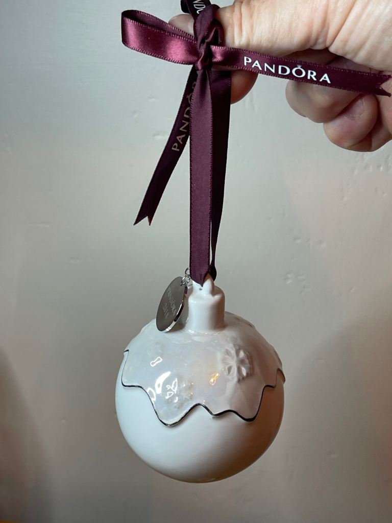 Pandora 2018 Ceramic Christmas pud bauble 2018 with purple ribbon and snowflake detail.
