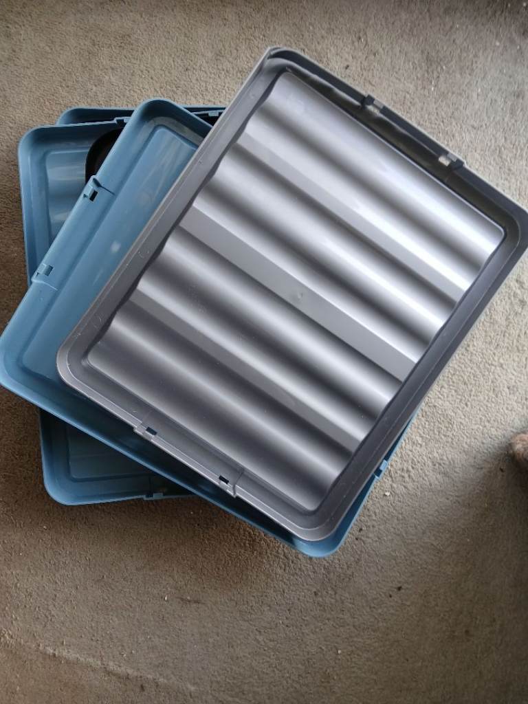 Assorted plastic lids for storage boxes