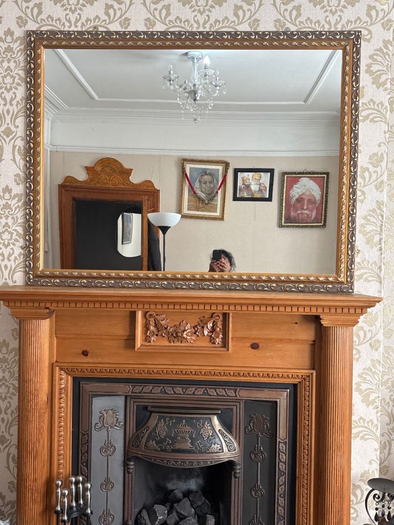 Beautiful gold mirror with a beautiful design on it