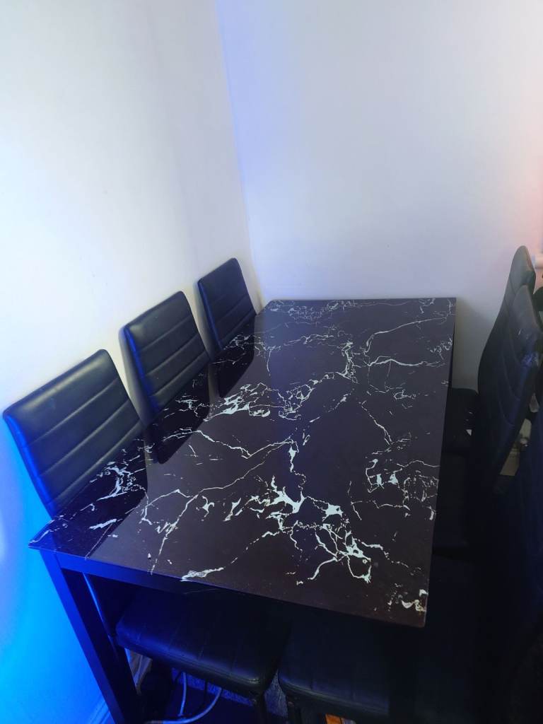 Marble effect glass dining table and chairs