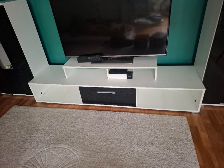 Modern White TV Unit with Black Drawer – Good Condition