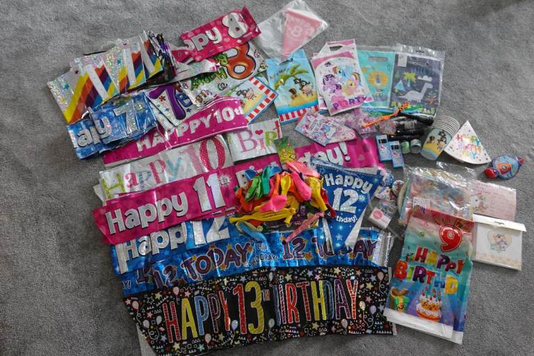 Birthday & party items: banners, balloons, badges, party bags, invites. *Over £50 items for **£10**