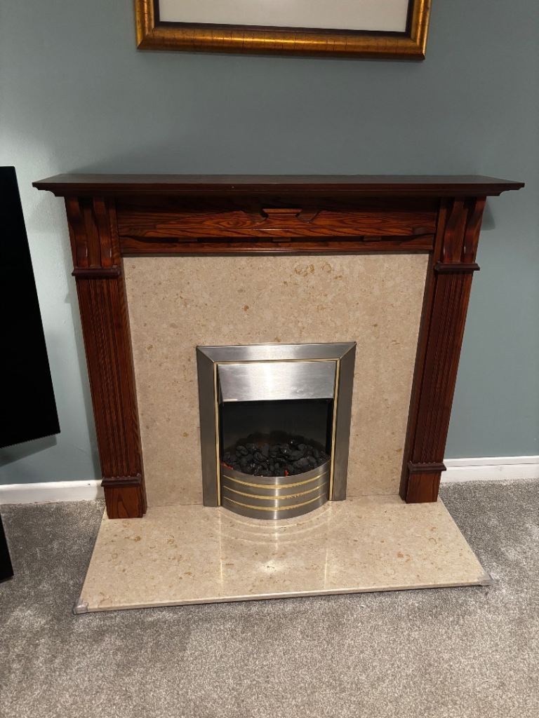 Electric fire, marble fireplace and mantelpiece 