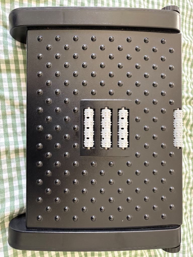 Under desk foot rest with massage rollers