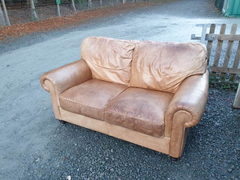 Lovely quirky tan leather sofa .delivery available