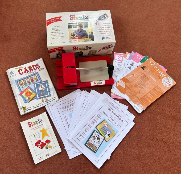 Sizzix die-cutting machine, boxed with instructions, ideas book & project papers 