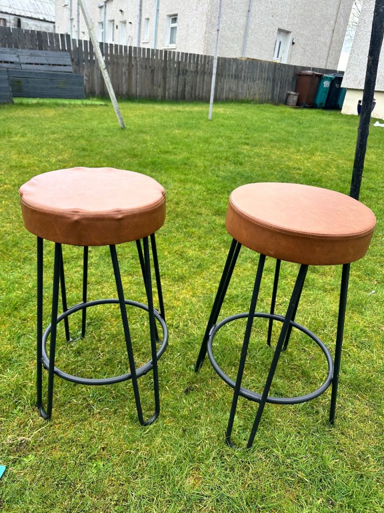 Two leather seated stools