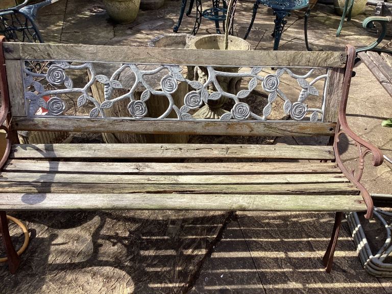 GARDEN CAST IRON BENCH WITH PLASTIC ORIGINAL BACKING , NEEDS TLC