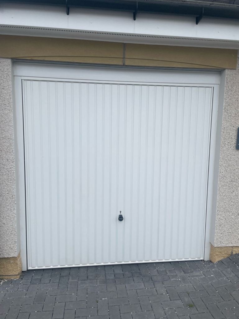 HORMANN WHITE UP-AND-OVER GARAGE DOOR.