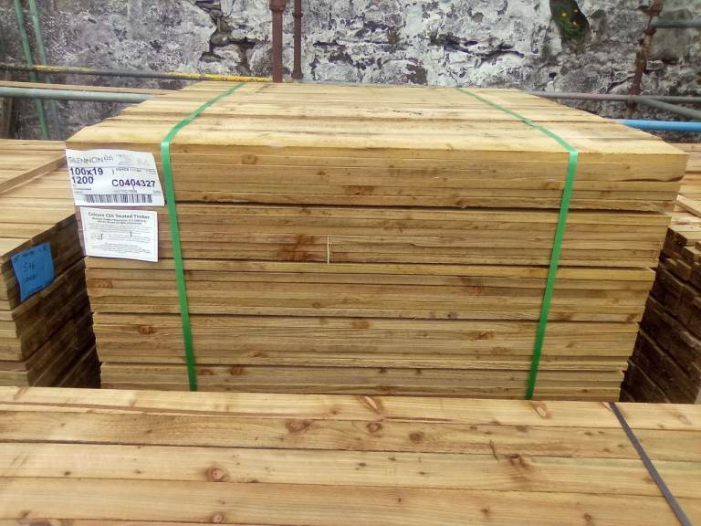 New green treated fence slats