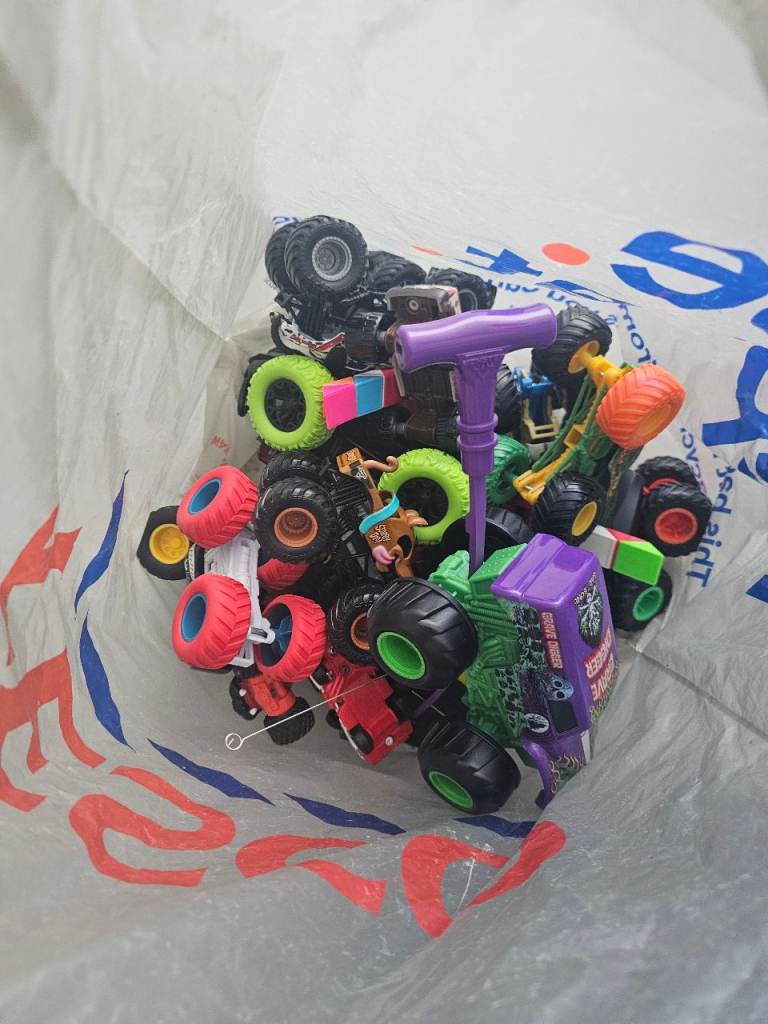 Bag full of monster trucks and cars