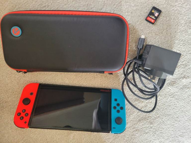 Nintendo Switch OLED Console with Joy-Cons, Charger and Games