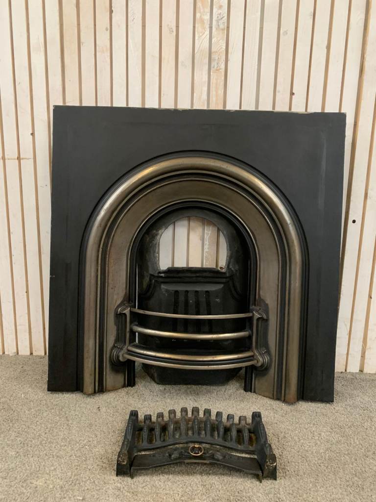 A Beautiful Cast Iron Polished Arched Insert Fireplace.