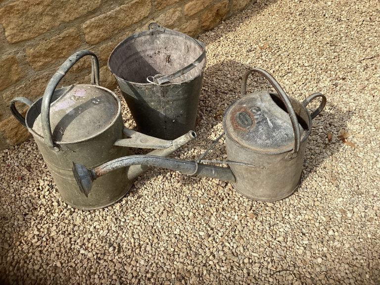 Vintage galvanised watering cans