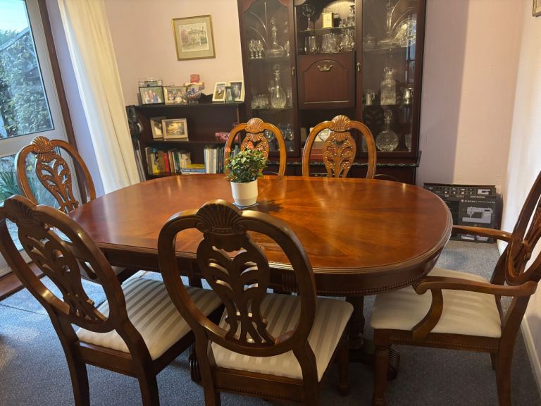 Dark wood dining table and 6 chairs. 