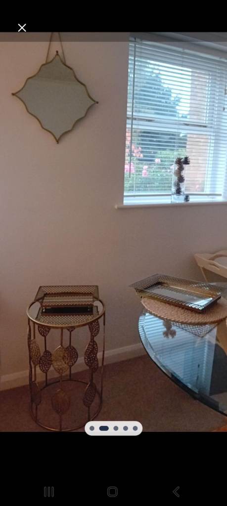 Serving trays, mirror and side table all with a matching decorative gold edge