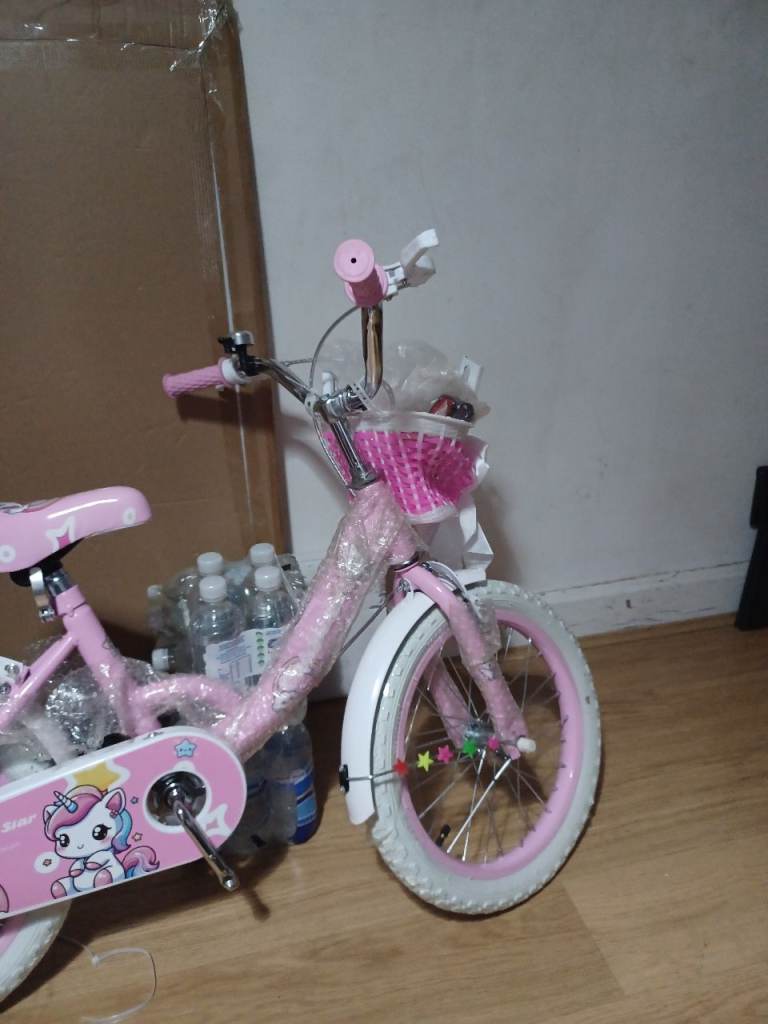 New kids bikes 16inch with training wheels in pink or turquoise these are new in the boxes 