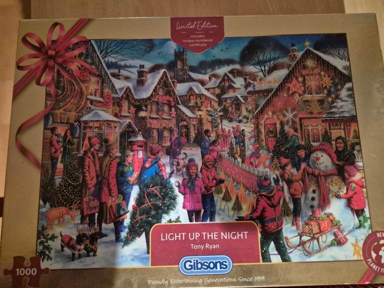 New sealed 1000 piece Gibsons Christmas jigsaw puzzle and two other opened Christmas puzzles