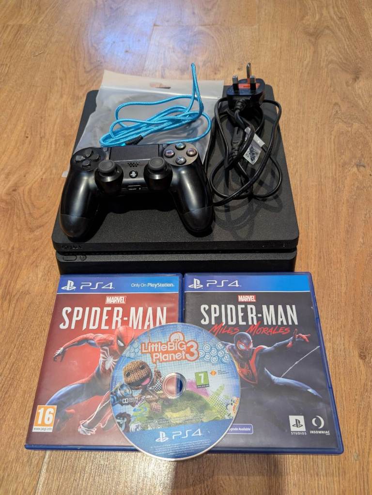 Sony PlayStation 4 (PS4) with Controller and Games