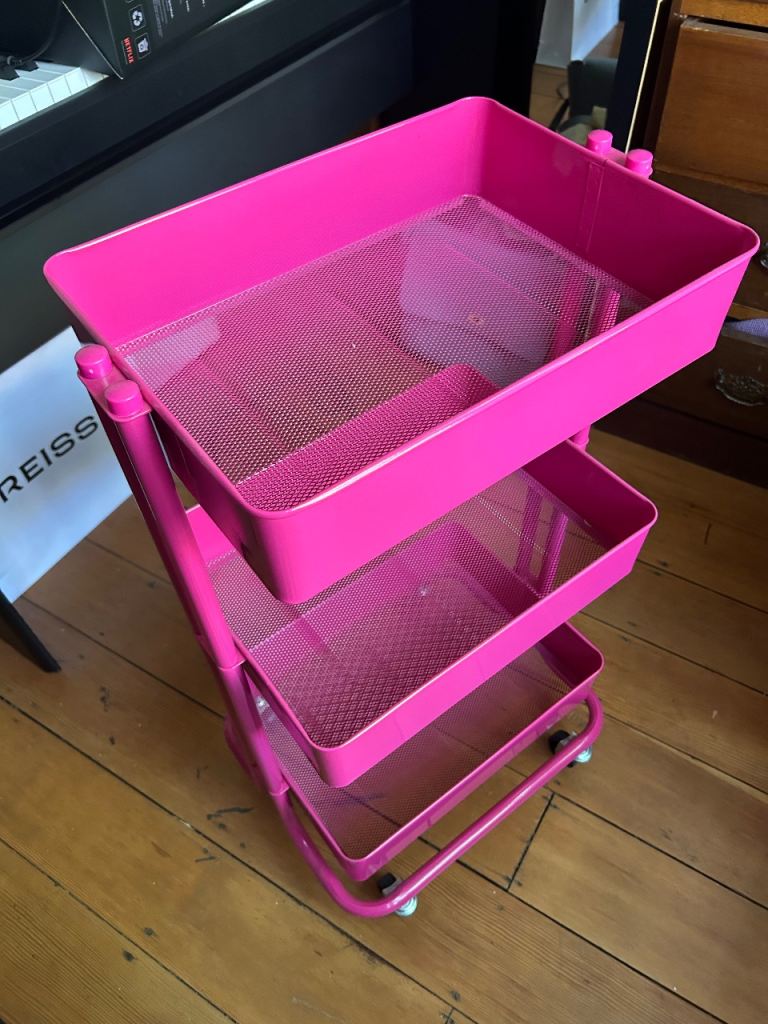 Pink metal storage trolley