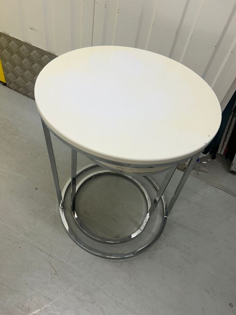 2 white round side tables 