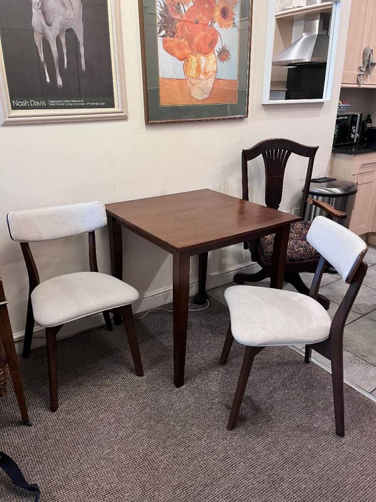 square dining table and 2 chairs