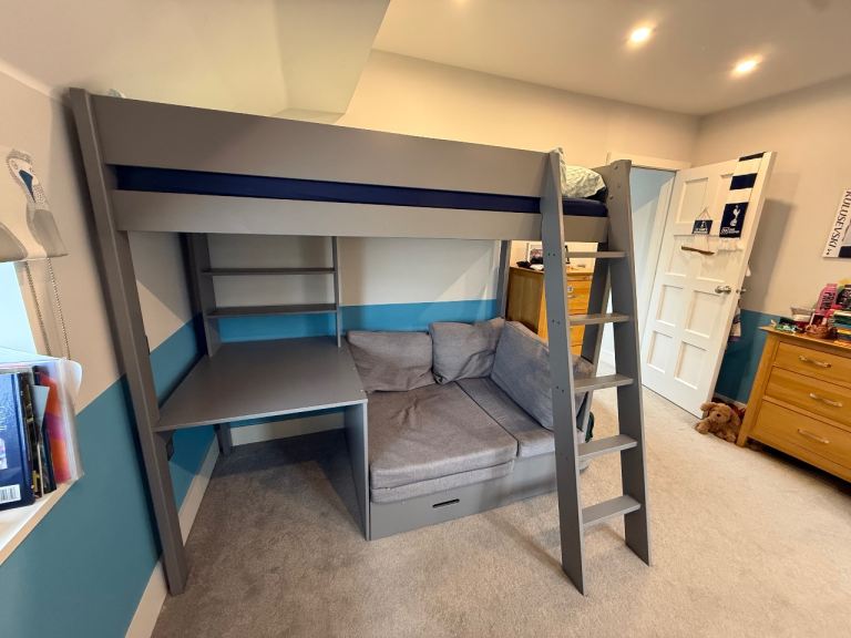 High sleeper single bed, with desk and sofa space which extends into an additional single bed. 