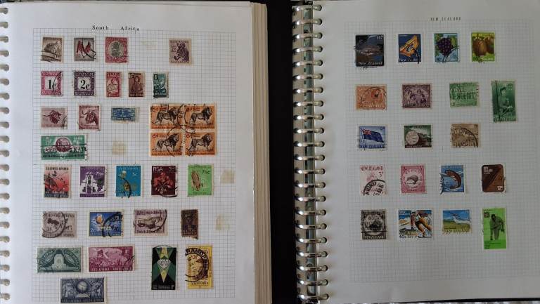Five Large Stamp Albums filled with Foreign Stamps from Aden to Zimbabwe.