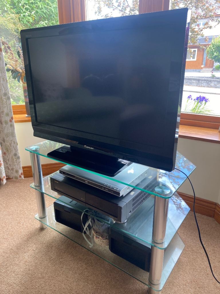 Toshiba LCD colour TV, 3 tier glass TV stand, DVD player, TOSHIBA VHS Player