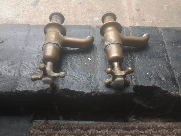 Old solid brass bath taps