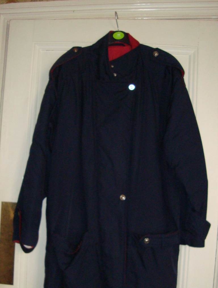 Navy coloured raincoat, jacket. Size 14