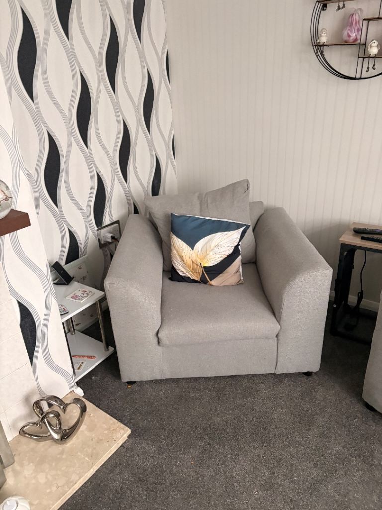 Brand new grey two seater settee with chair and puffy 