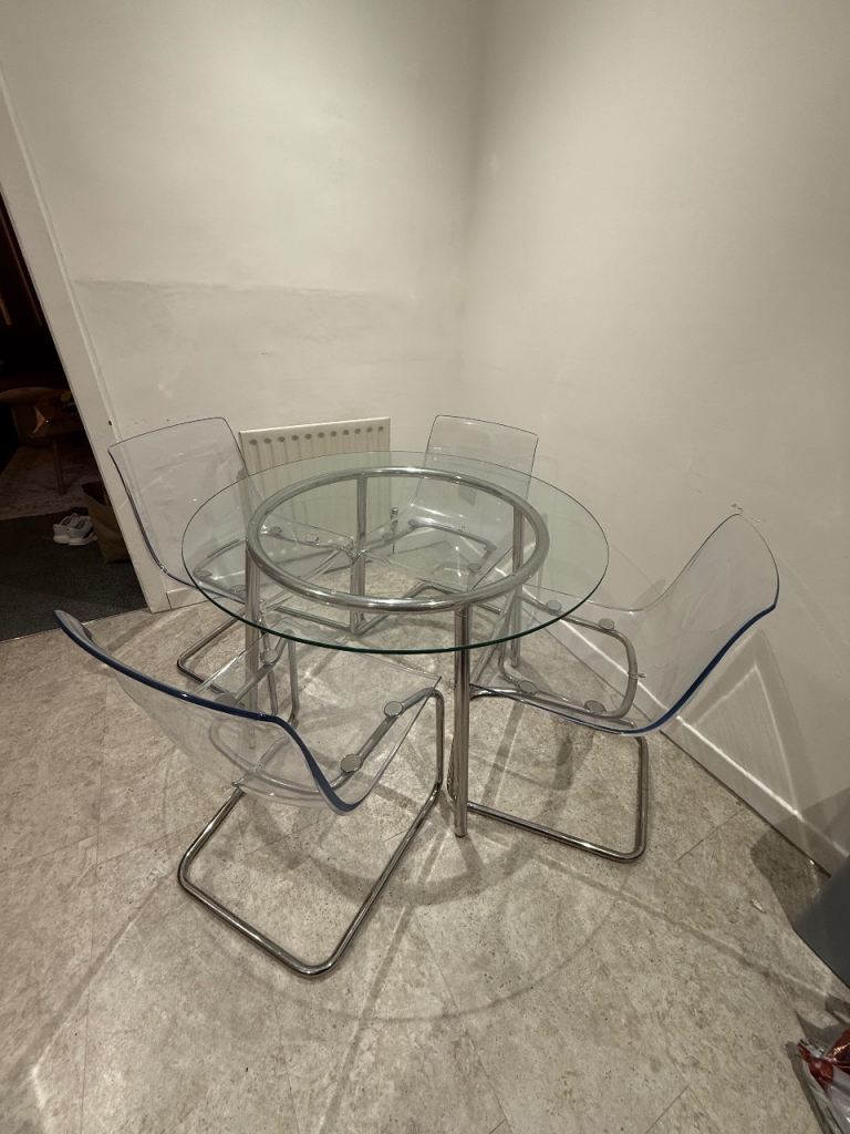 image for Round glass dining table and ghost chairs