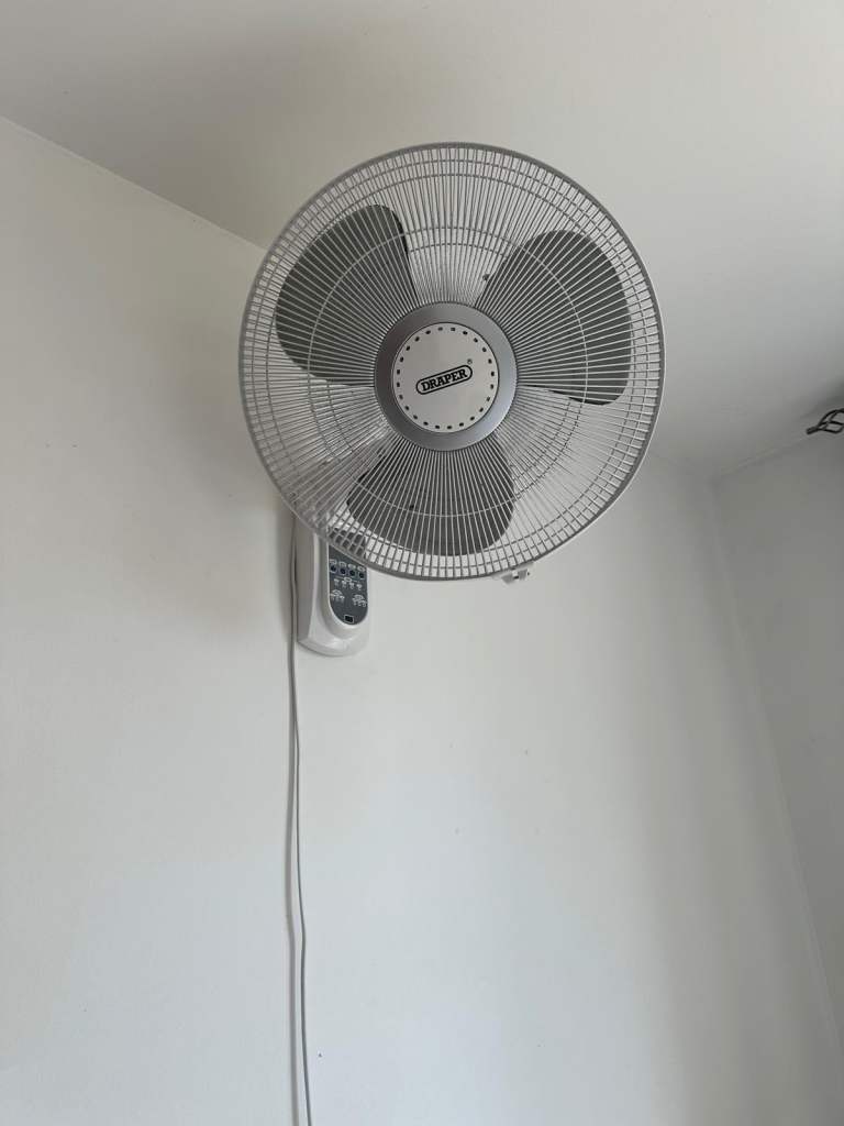 Quest Wall Mounted Fan with Remote – Good Condition