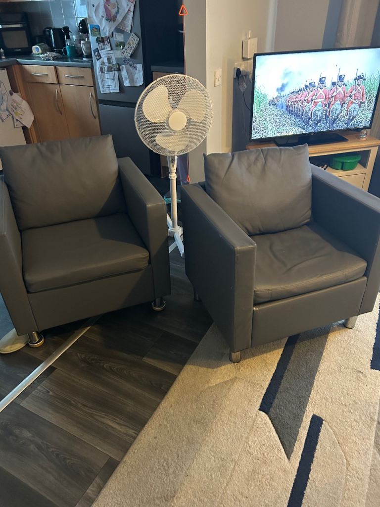 Pair faux leather armchairs