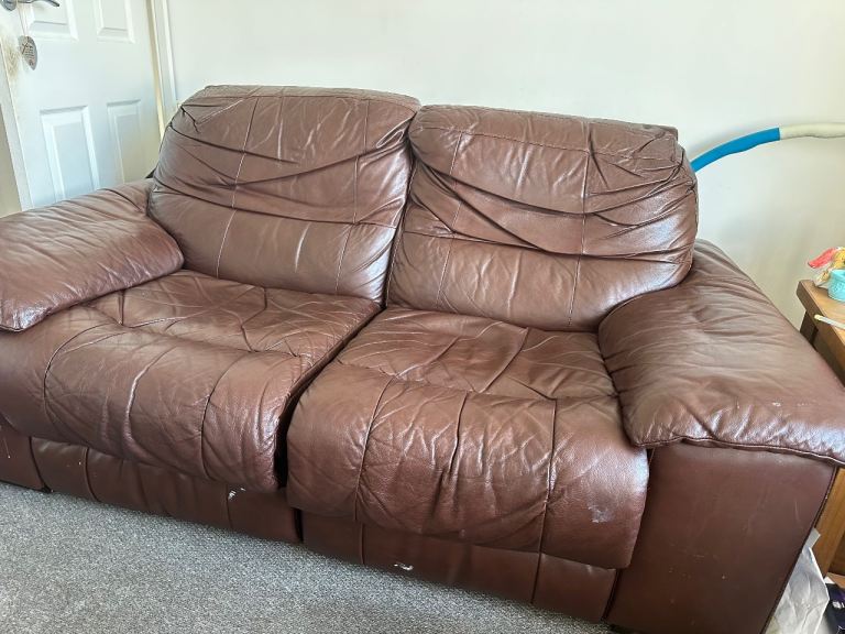 Brown leather arm chair with matching two seater electric recliner sofa