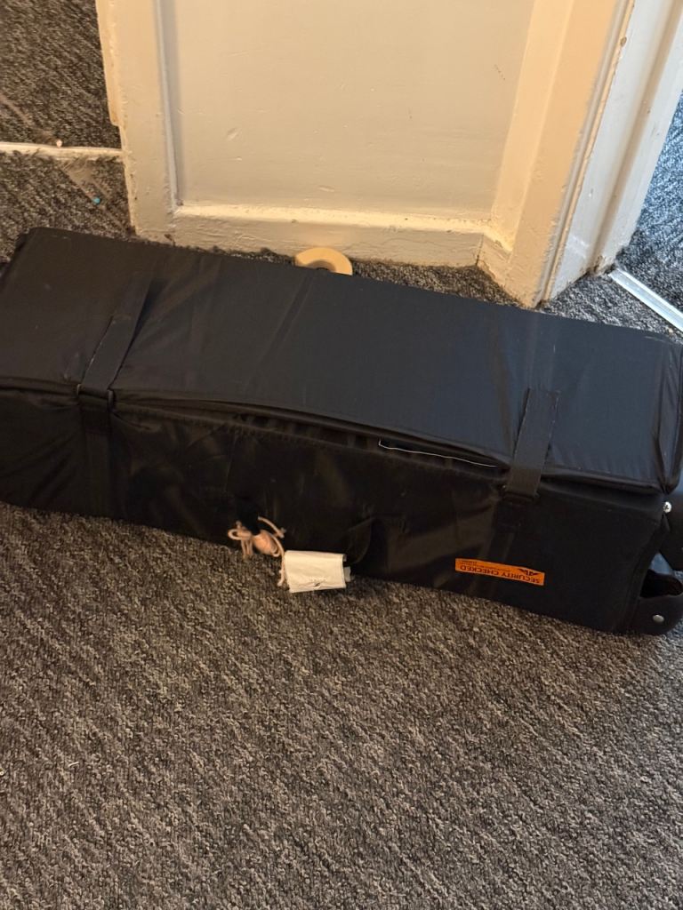 Red kite travel cot black