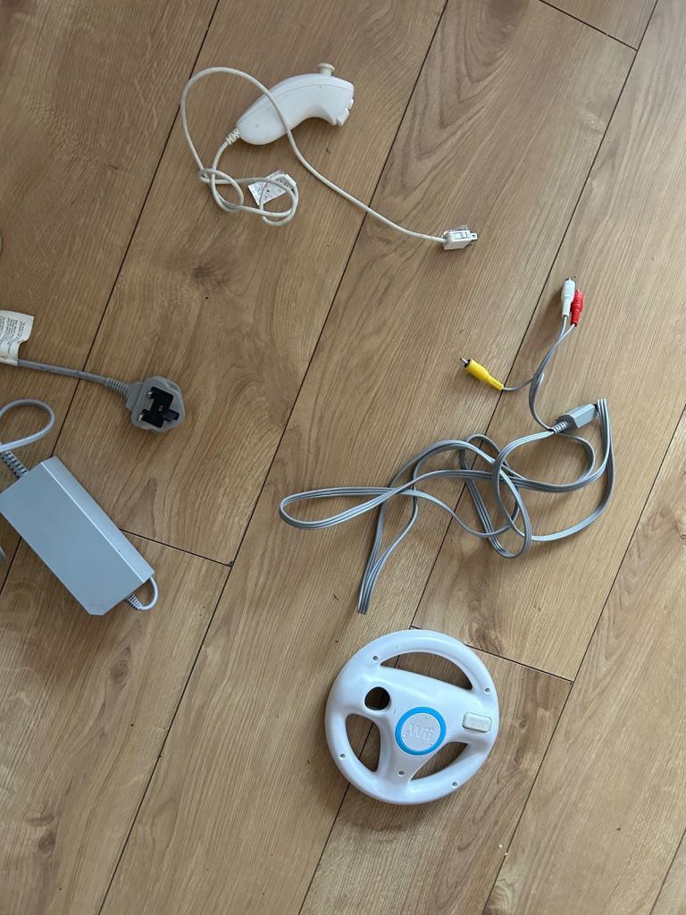 Nintendo wii accessories - 5 pounds each - nunchuk , power supply , av cable , steering wheel
