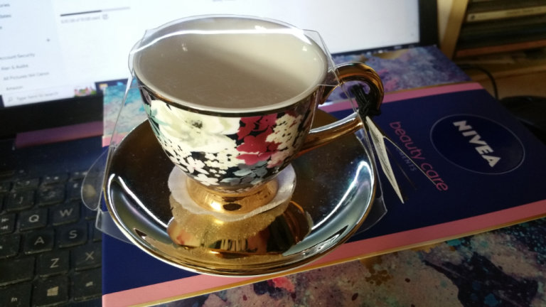 Brand new small cup & saucer