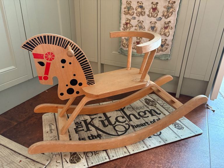 Vintage retro child’s wooden rocking horse. Solid and durable. 