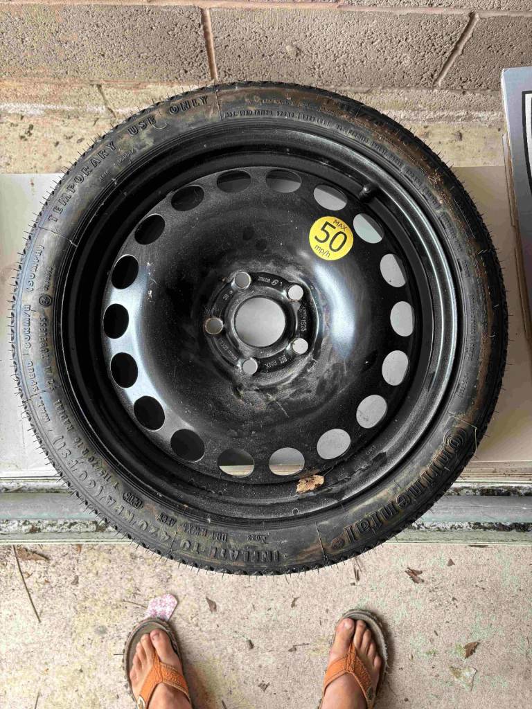 Space saver wheel with new tyre. 